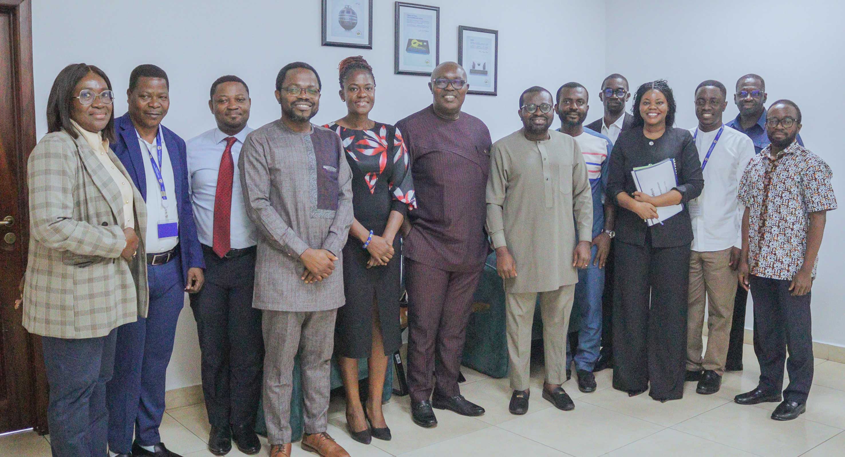 Representatives of ISSER and the National Communications Authority (NCA) pose for a group photograph following the signing of the Memorandum of Understanding.